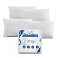 Four white quilted zipped pillow protectors with their packaging