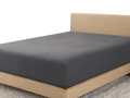 Grey brushed microfibre fitted sheet on a bed base